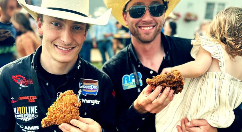Fried chicken at calgary stamepede eaten by two rodeo riders