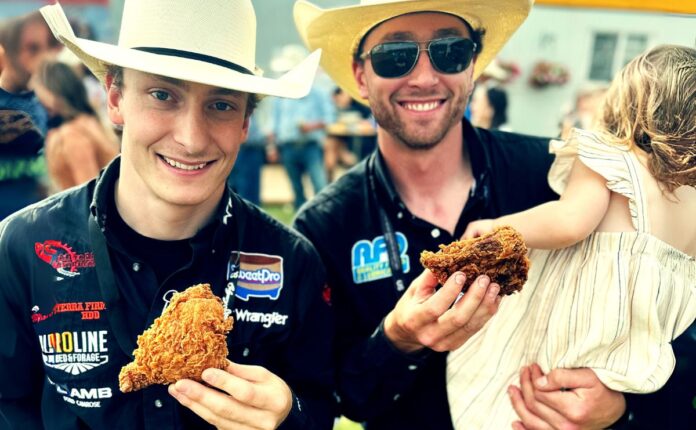Fried chicken at calgary stamepede eaten by two rodeo riders