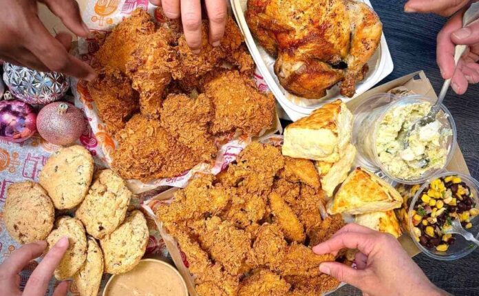 fried chicken, salads and sides catered to a family gathering