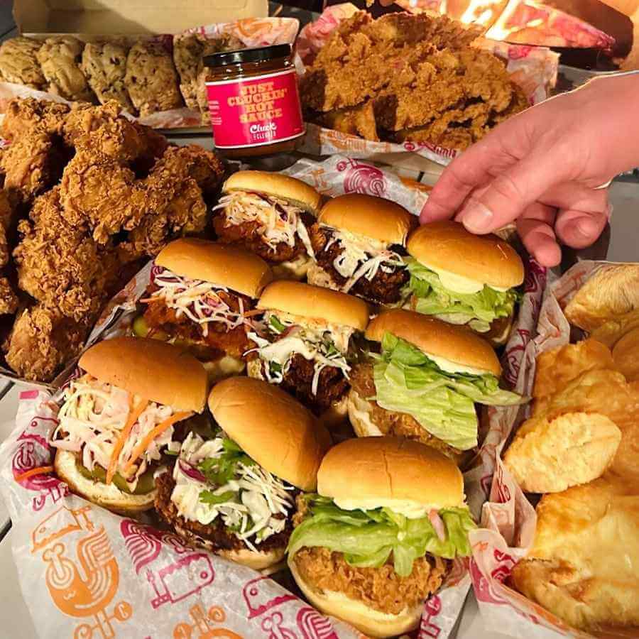 table full of fried chicken sandwiches that were catered to an office in Calgary